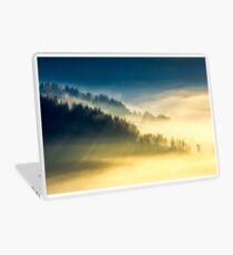 deep fog above the valley at sunrise Laptop Skin