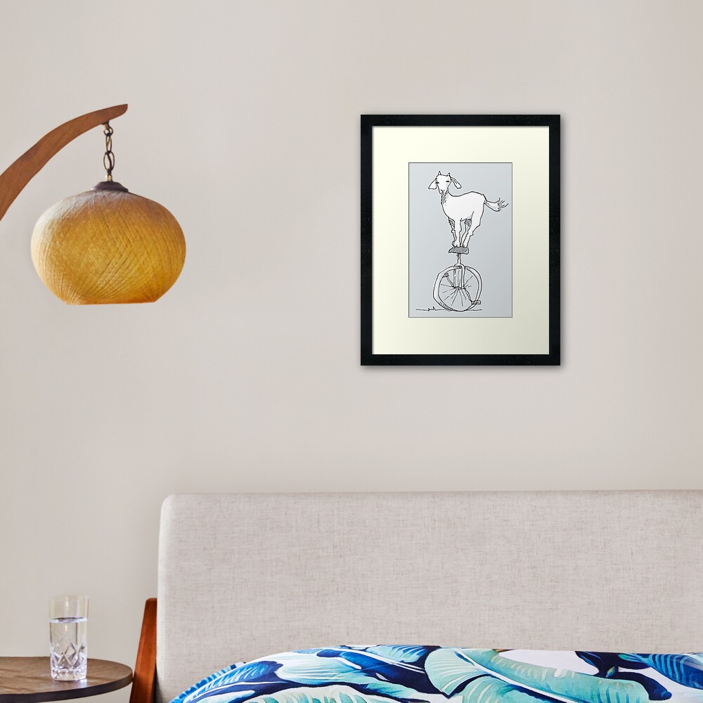 Goat on a unicycle Framed Art Print