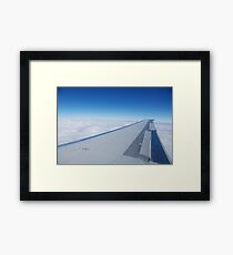 above the clouds Framed Print