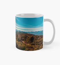 Sunny autumn day at the mount Tersadia in the italian alps Mug