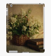 Still life with old books and white flowers in the basket iPad Case/Skin