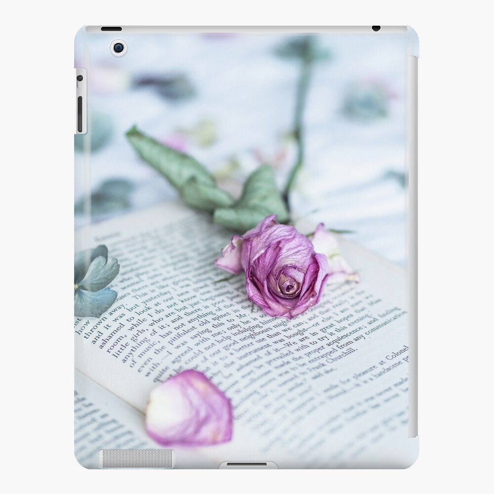 Still Life of Fading Rose on Book iPad Case & Skin