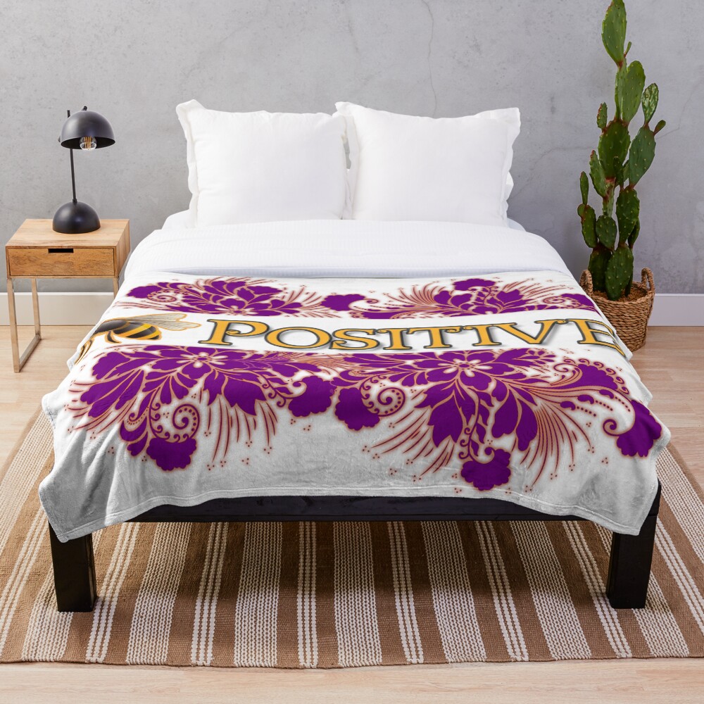 Bee Positive on a throw blanket