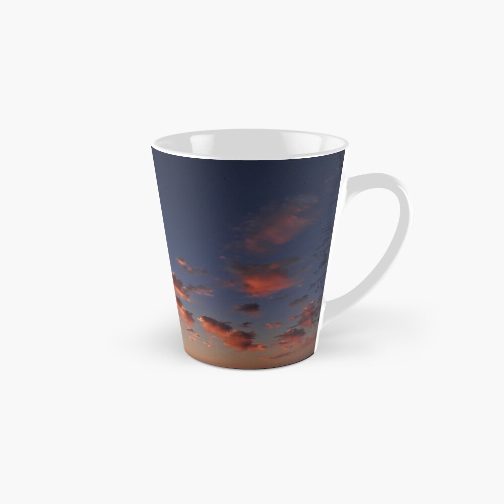 Puffy clouds at sunset Tall Mug