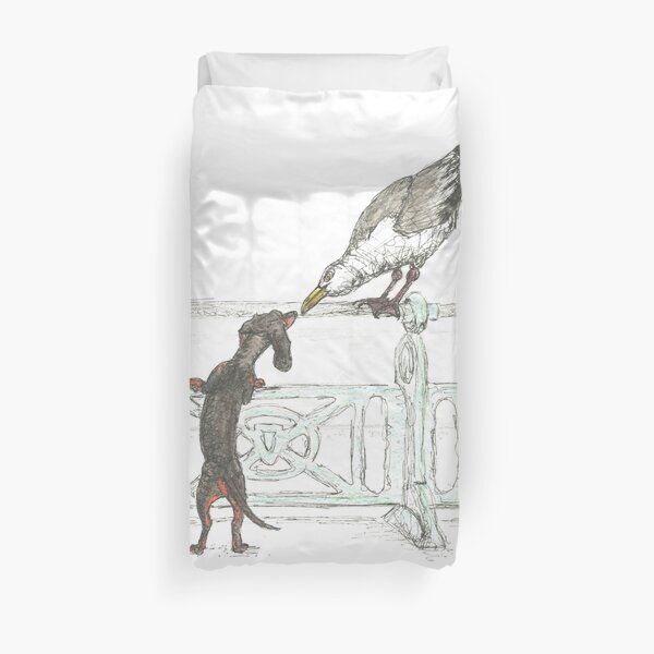Dachshund and Seagull on Brighton Beach UK. Sausage dog by the sea. Duvet Cover