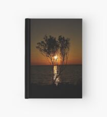 Sunset Behind Tree Hardcover Journal