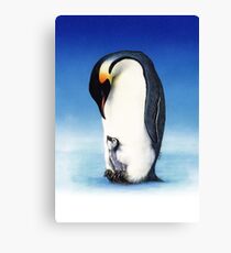 Emperor penguin with chick Canvas Print