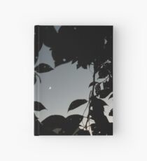 Cuaderno de tapa dura Luna creciente sin editar a través de las hojas