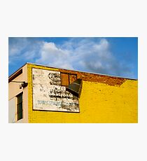 Shady Billboard on Yellow Wall Photographic Print