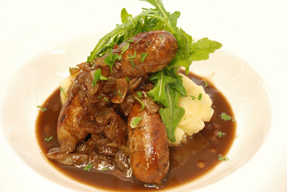"Pork and fennel sausages with herbed mash and caramelised onion gravy
