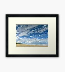 A Buffeting on the Beach Framed Print