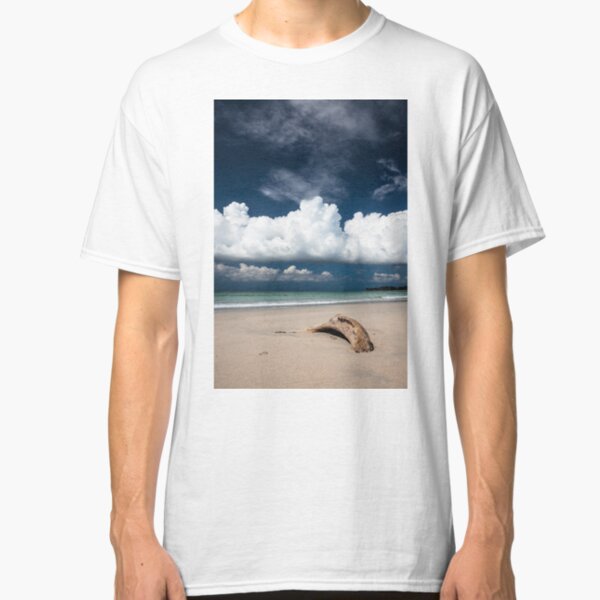 Beach driftwood and dark blue sky Classic T-Shirt