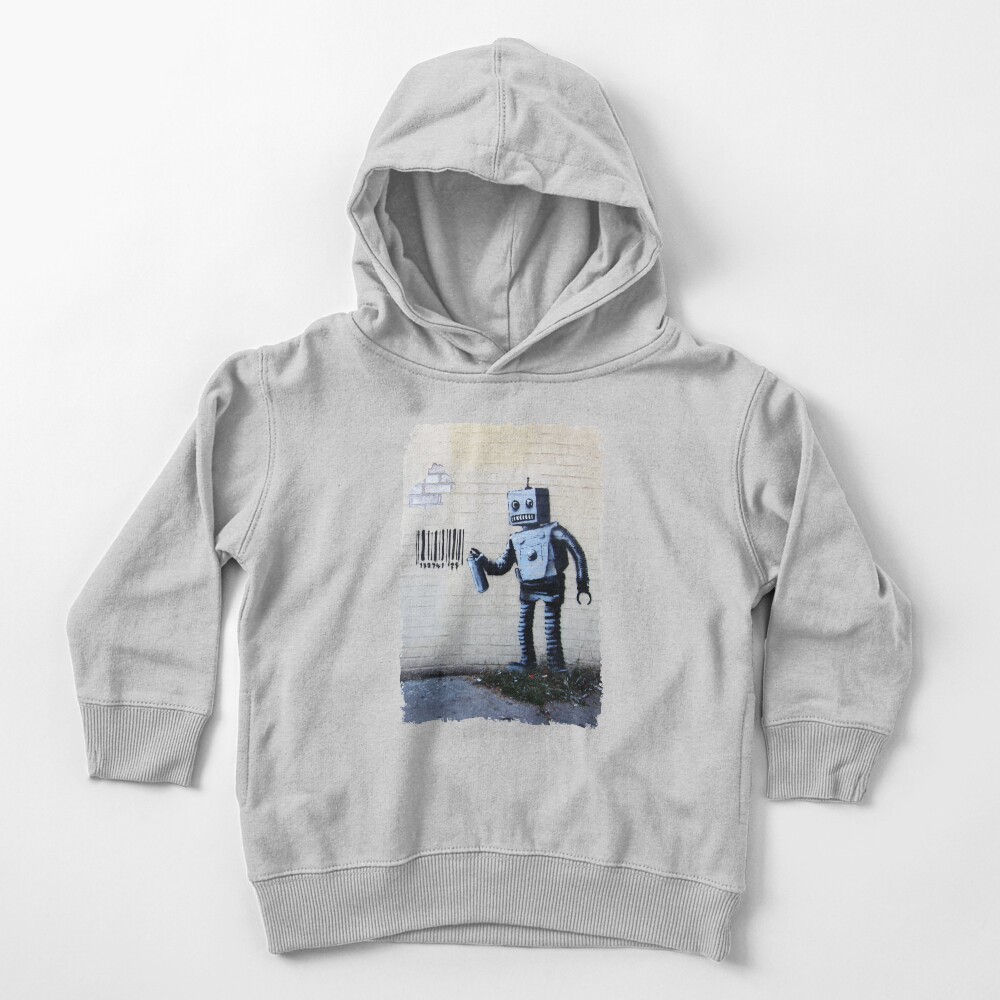Banksy graffiti smiling Robot and barcodes Better Out Than In New York City residency on brick wall Toddler Pullover Hoodie