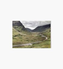 The A82 road sweeps through Glencoe, Highlands of Scotland Art Board Print