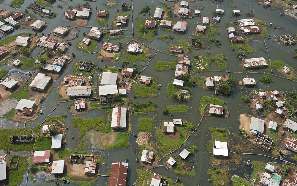 "Homes in swamp around Bushrod Island, Monrovia, Liberia" by