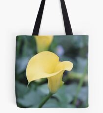looking at a lily Tote Bag