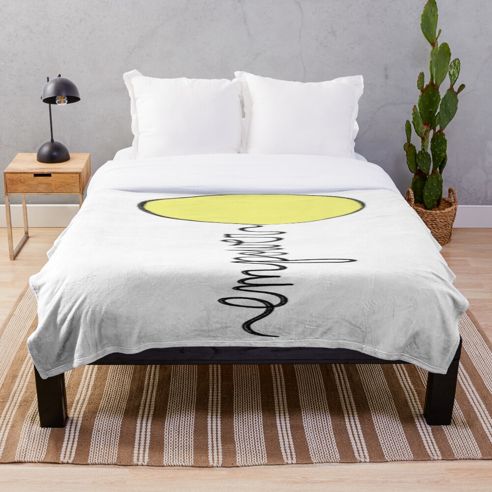 Empower Balloon on a throw blanket