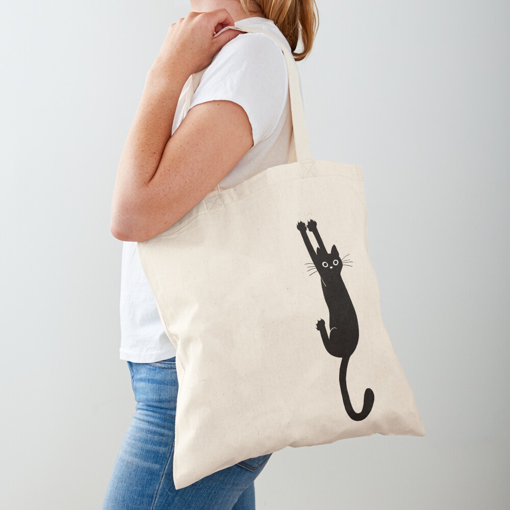 Black Cat Holding On Tote Bag