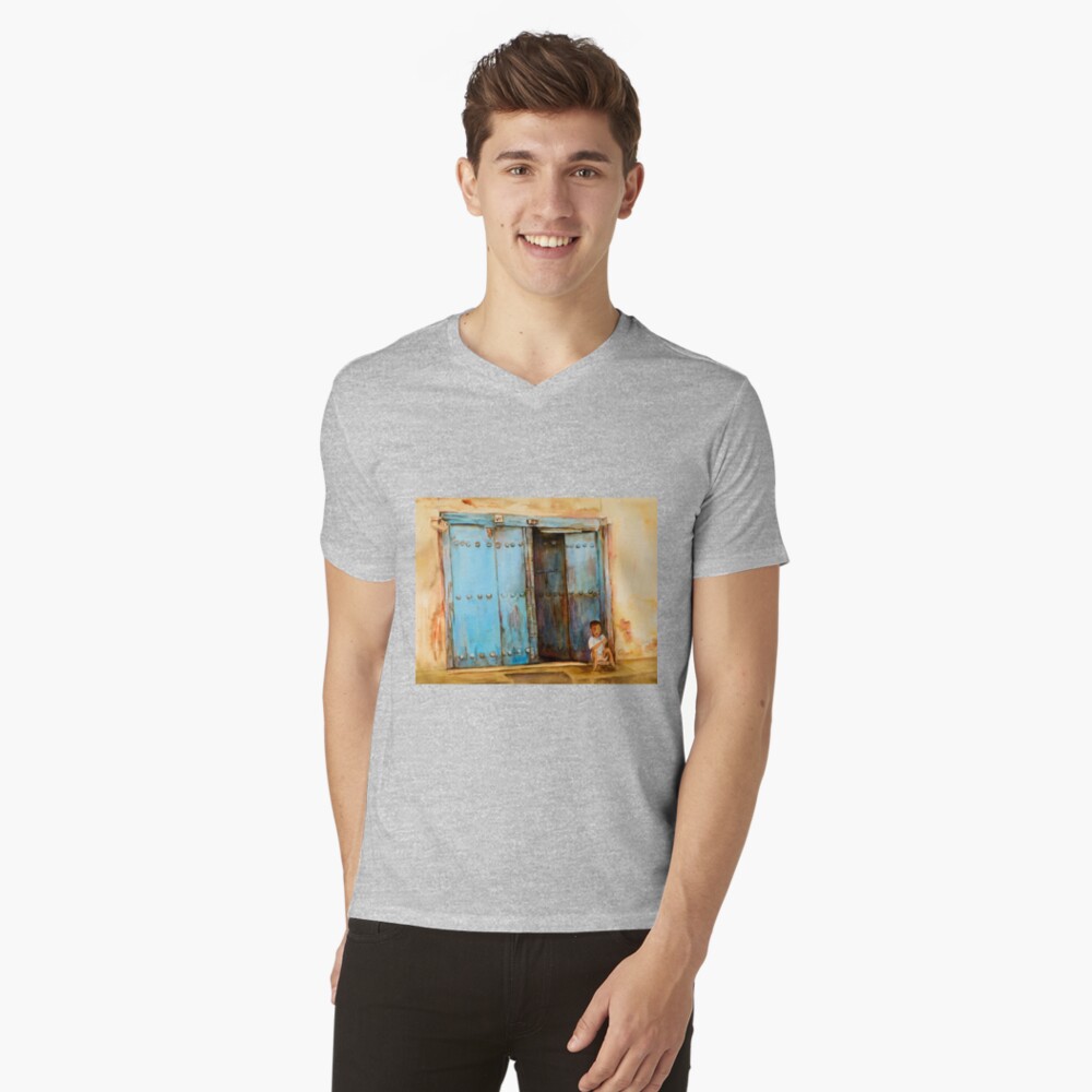 Child sitting in old Zanzibar doorway V-Neck T-Shirt