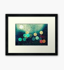Rain and the city Framed Print